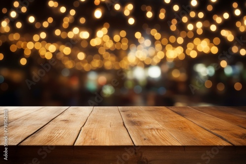 b'Empty wooden table with a blurred background of bokeh lights'