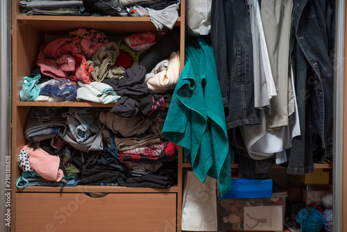 Konstfotografi Messy closet. Clutter in the wardrobe with clothes