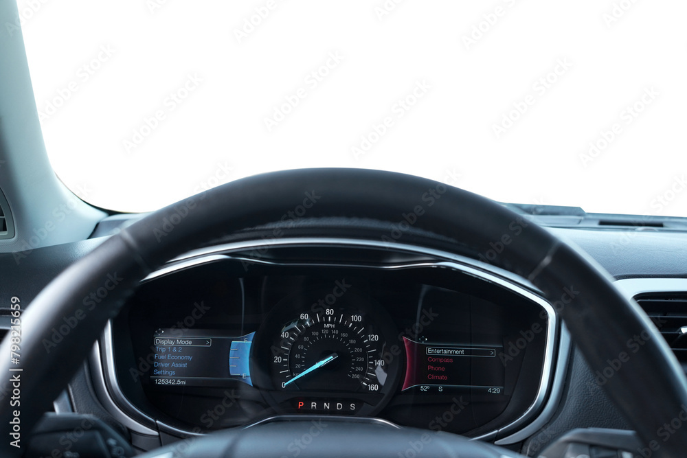 Speedometer on dashboard and steering wheel inside car