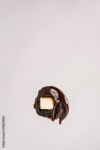Cross-sectional view of a chocolate candy with milk sufdoye inside