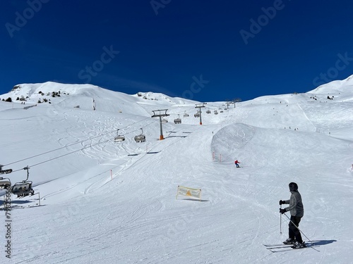 A typical winter idyll on the frozen and snow-covered alpine lake Heidsee (Igl Lai) in the Swiss winter resorts of Valbella and Lenzerheide - Canton of Grisons, Switzerland (Schweiz) photo