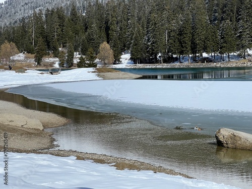 A typical winter idyll on the frozen and snow-covered alpine lake Heidsee (Igl Lai) in the Swiss winter resorts of Valbella and Lenzerheide - Canton of Grisons, Switzerland (Schweiz) photo