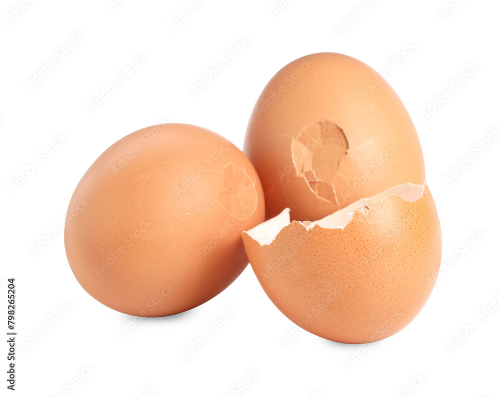 Whole and cracked chicken eggs isolated on white Whole and cracked chicken eggs isolated on white