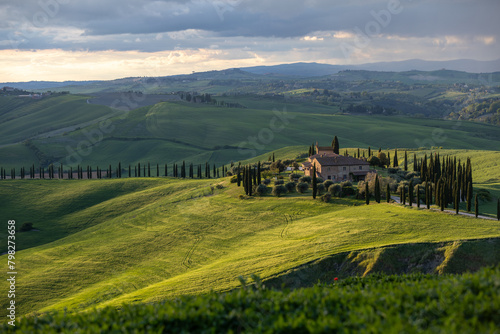 early morning with beautiful sunrise over the Val d'Orcia, countryside in Tuscany.