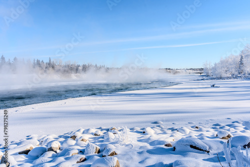 Vaporizing water of the river in winter © Murat