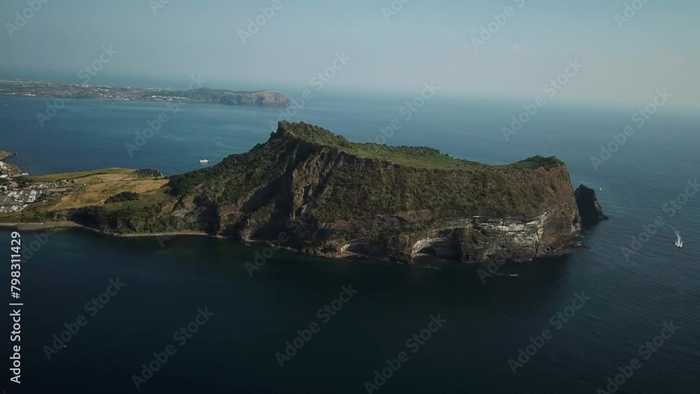Drone shot of Seongsan Ilchulbong in Jeju Island, Republic of Korea. Aerial view of Crater peak in South Korea. High quality 4k footage Drone shot of Seongsan Ilchulbong in Jeju Island, Republic of Korea. Aerial view of Crater peak in South Korea. High quality 4k footage