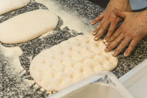 cloeup shot of chef's hands kneading pizza dough, pizza making concept. High quality photo photo