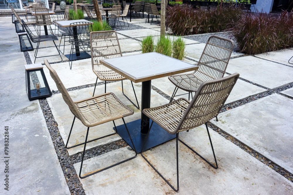 Empty of dining table and chairs of outdoor restaurant or cafe, nature concept Empty of dining table and chairs of outdoor restaurant or cafe, nature concept
