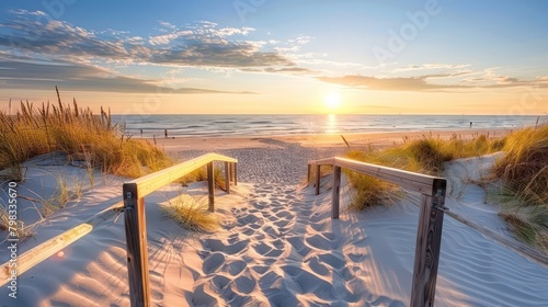 Beautiful sand dune beach at sunset with wooden bridge © jongaNU
