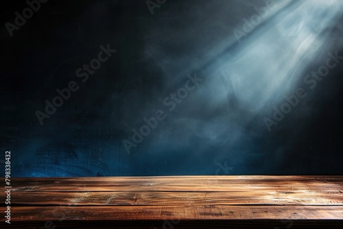 empty wooden table on dark background