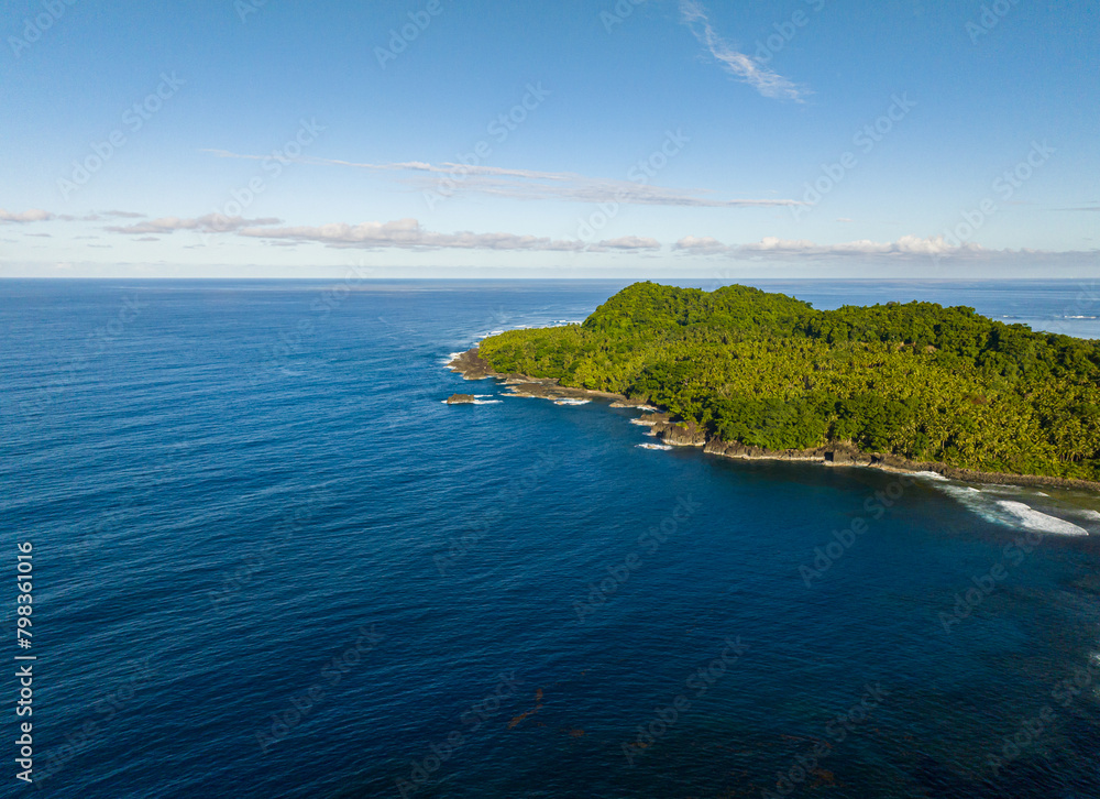 Beautiful top view of Tropical Island. Deep blue sea in beachline. Mindanao. Philippines.