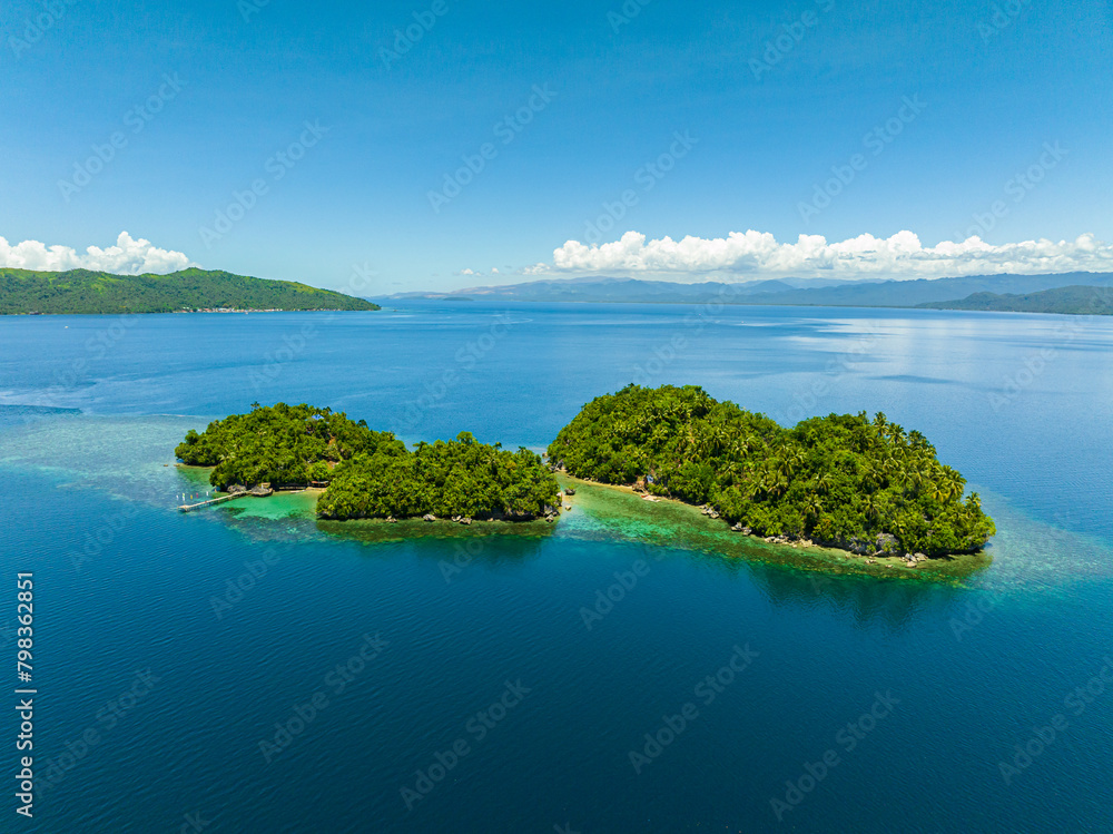 Islands with beach resort in tropical landscape. Bangkay Island. Mindanao, Philippines. Summer and travel concept.