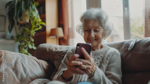 Happy senior female holding smartphone using mobile phone app. Technology, communication, happy adult woman with smartphone at home, recreation, communication, sociality, hobbies, adaptation