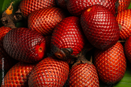 AGUAJE, A VERY CONSUMED FRUIT IN THE AMAZON REGIONS, AGUAJE OR BURUTI IS A DELICIOUS FRUIT, PHOTOGRAPH OF AGUAJE FRUIT, BURUTI FRUIT photo