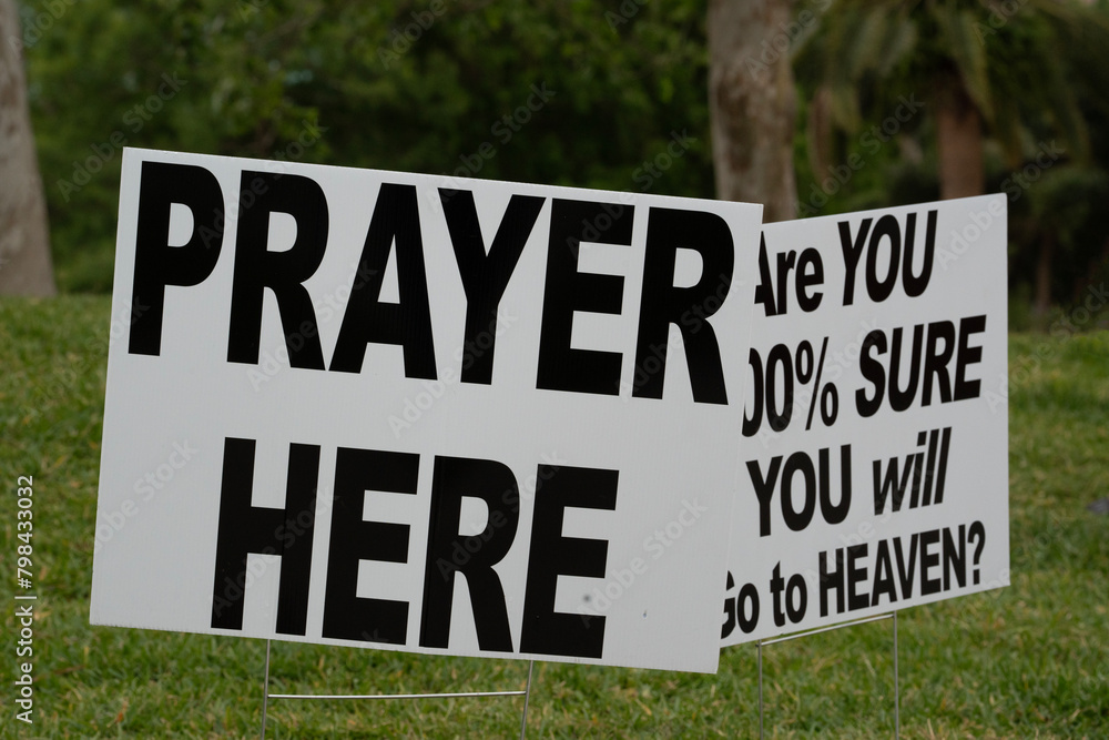 prayer here and go to heaven signs at an outdoor park
