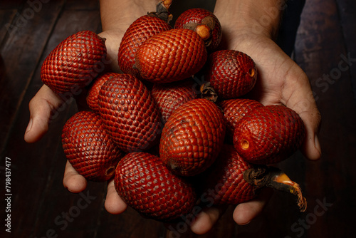 AGUAJE, A VERY CONSUMED FRUIT IN THE AMAZON REGIONS, AGUAJE OR BURUTI IS A DELICIOUS FRUIT, PHOTOGRAPH OF AGUAJE FRUIT, BURUTI FRUIT photo