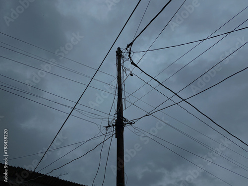 Wallpaper Mural Power supply pole and cables, with dark cloudy sky background Torontodigital.ca