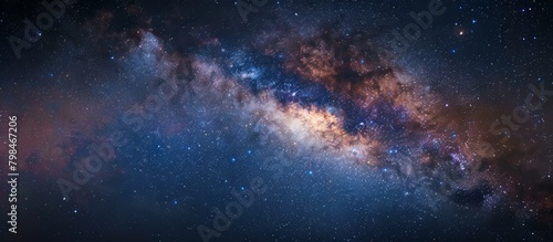 Glimpse the mesmerizing beauty of the starry night sky with the milky way shining brightly above © LukaszDesign