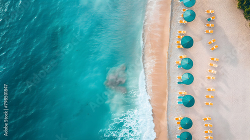Aerial View of a Pristine Tropical Beach with Sunshades and Turquoise Sea