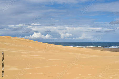 Walk through the sand dunes to Tin City