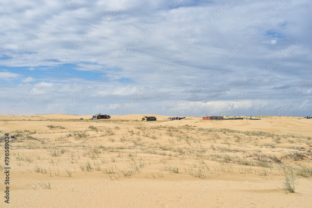 Walk through the sand dunes to Tin City Walk through the sand dunes to Tin City