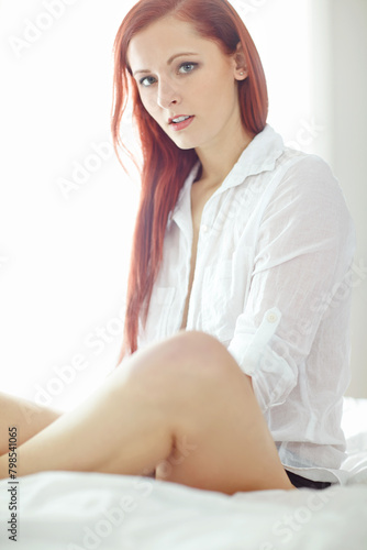 Sexy, shirt and portrait of woman on bed for sensual style, confidence and temptation at home. Serious, relax and ginger person with pride in morning for alluring outfit, luxury fashion and clothes