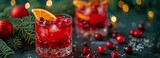 Oranges and cranberries in a red Christmas cocktail.