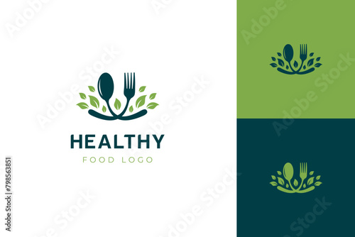 Healthy food logo icon design with a fork spoon and leaf graphic shape for branding organic food businesses or health conscious products