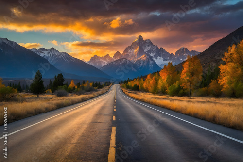 A highway towards mountains at sunset