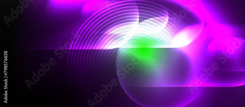 A vibrant purple and green glowing circle illuminated against a dark black background, symbolizing colorfulness and energy in art and technology