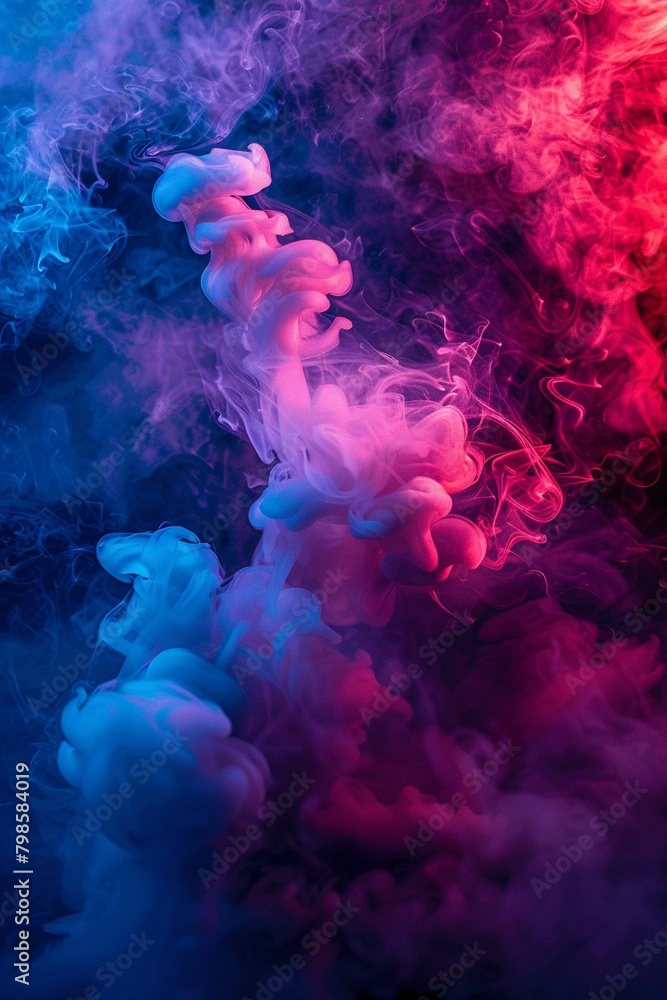 Dramatic smoke and fog in contrasting vivid red, blue, and purple colors Vivid and intense abstract background or wallpaper