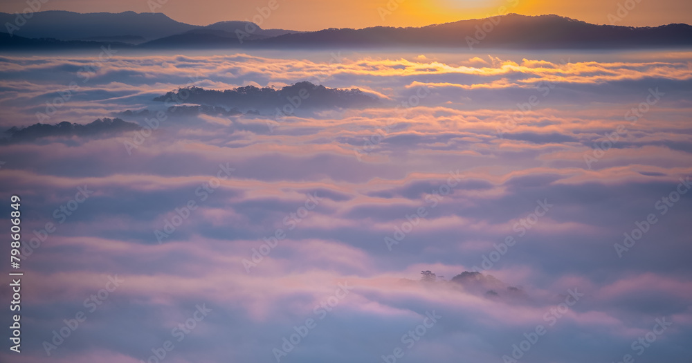 Fototapeta premium Rising sun shining with clouds and mountains below. cloud hunting