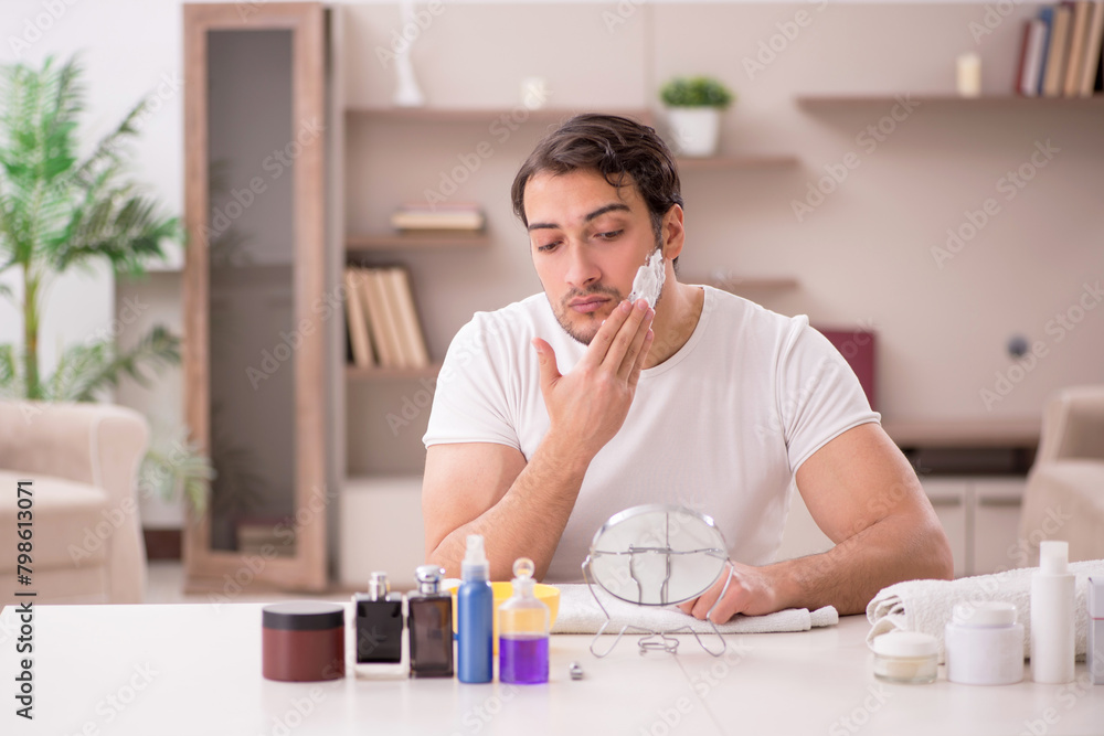 Young man shaving face at home Young man shaving face at home