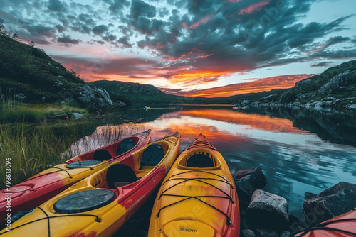 Kayaks resting by the tranquil shore of a glassy lake, reflecting the vibrant hues of a sunset.