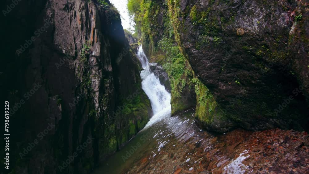 Waterfall in mountains. Steadicam shot. Waterfall in mountains. Steadicam shot.