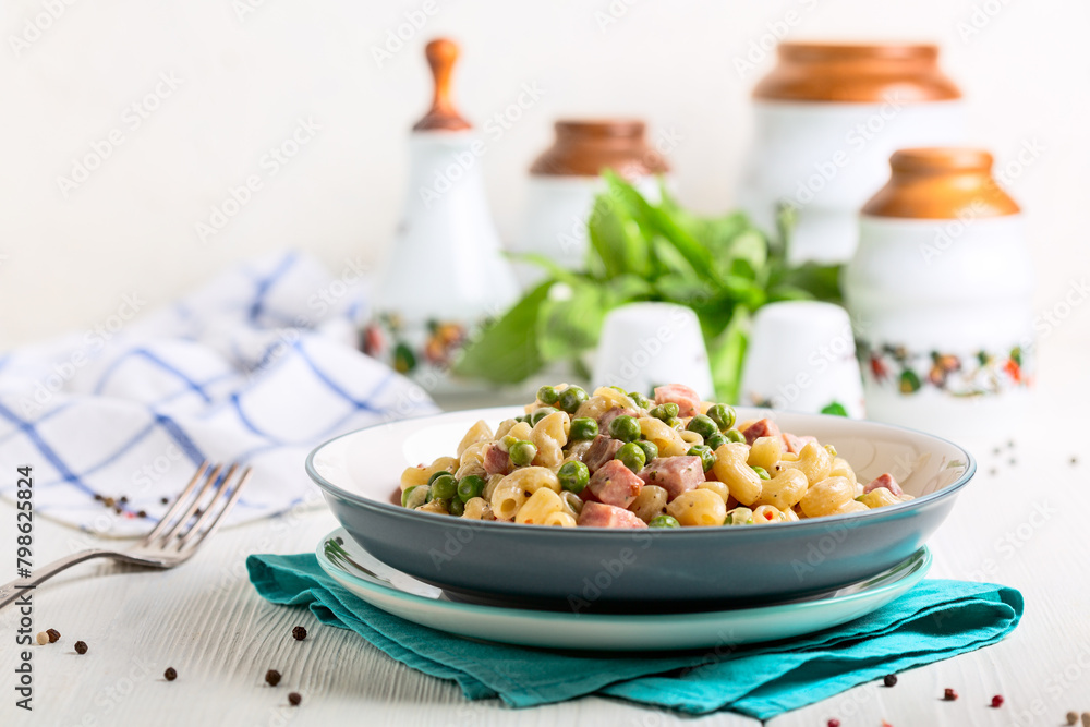 Homemade pasta with green peas and ham. Homemade pasta with green peas and ham.