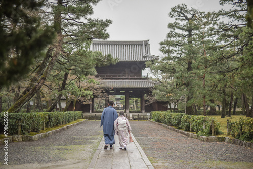 Rainy Day Walking Trip With Japanese Traditional Kimono On The Old Town Kyoto During Sakura Season, Higashiyama District, Kyoto, Japan photo