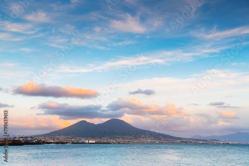 Naples city and Gulf of Naples, Italy. Vesuvius volcano with pink clouds at sunset.