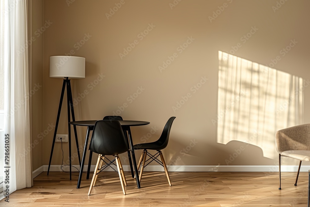 Minimalist Modern Dining Area with Black Furniture and Wooden Floor Accentuated by Warm Lamp and Contemporary Chair Minimalist Modern Dining Area with Black Furniture and Wooden Floor Accentuated by Warm Lamp and Contemporary Chair