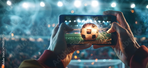 Mobile phone Soccer betting. Soccer field on smartphon. bet and win concept.Watch a live sports event on your mobile device. Betting on football matches	 photo
