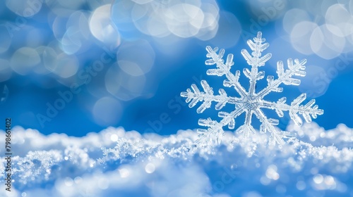  A snowflake atop a snow-laden mound, adjacent to a blue sky