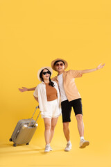 Portrait image of couple posing on yellow background, summer, travel