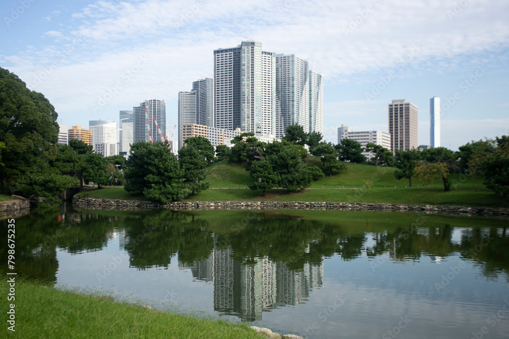 The Gardens of Hamarikyu are a public park in Chūō, Tokyo, Japan. Located at the mouth of the Sumida River they are surrounded by modern buildings. The Gardens of Hamarikyu are a public park in Chūō, Tokyo, Japan. Located at the mouth of the Sumida River they are surrounded by modern buildings.
