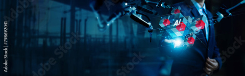 .Ai technology industry, Machinery production Industry 4.0, Digitalization Industrial, Technician manager holding industrial icon on cube and Ai Automation robotics arm machine background. © ipopba