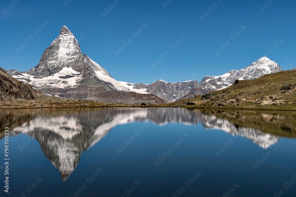 Reflection of the Matterhorn Mountain in a lake, Swiss Alps