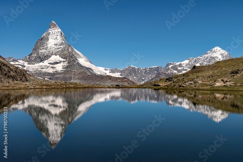 Reflection of the Matterhorn Mountain in a lake, Swiss Alps