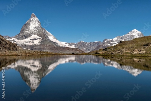 Obraz na płótnie Reflection of the Matterhorn Mountain in a lake, Swiss Alps w salonie