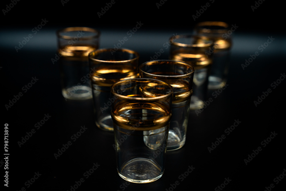 glass of water with gold rings  close up