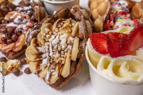 Hong Kong waffle with ice cream, topping, berries and sweets
