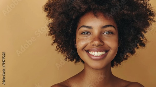 Black Girl Beauty. African American Woman with Clean Skin on Beige Background